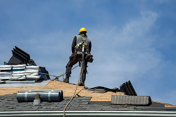 Professional Roofing technician working in Springs, NY